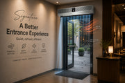 Commercial entrance with stainless steel air curtain blocking heat, dust, and insects