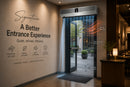 Commercial entrance with stainless steel air curtain blocking heat, dust, and insects
