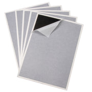 A pack of 5 replacement sticky glue boards for fly traps, with a part of one board showing adhesive side up.