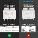 Comparison of LED and fluorescent light bulbs with labels on fly traps.