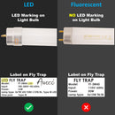 Comparison of LED and fluorescent light bulbs with labels on fly traps.