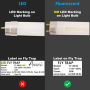 Comparison of LED and fluorescent light bulbs with labels on fly traps.