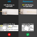 Comparison of LED and fluorescent light bulbs with labels on fly traps.