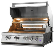 A stainless steel gas grill with its lid open, showing the lit interior grates and warming light. The grill has five control knobs on the front and is photographed on a plain white background.