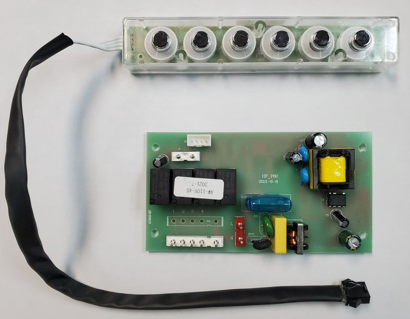 An Awoco range hood control panel and circuit board with 6 buttons, a glass tube fuse, and a black strap.